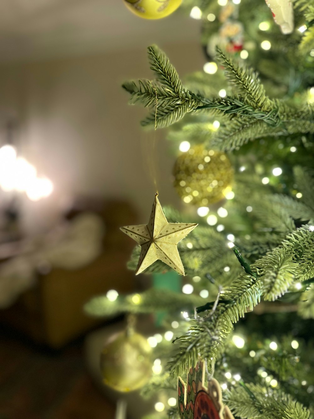 a christmas tree with ornaments hanging from it