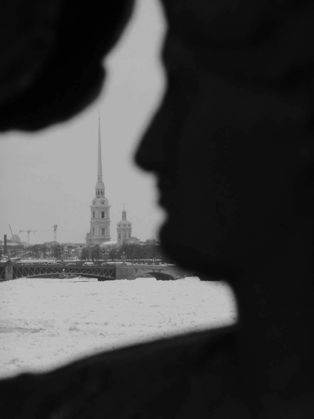 a black and white photo of a clock tower