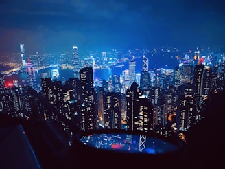 a view of a city at night from the top of a building