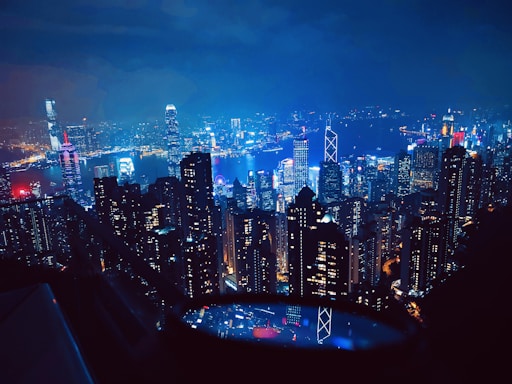 a view of a city at night from the top of a building