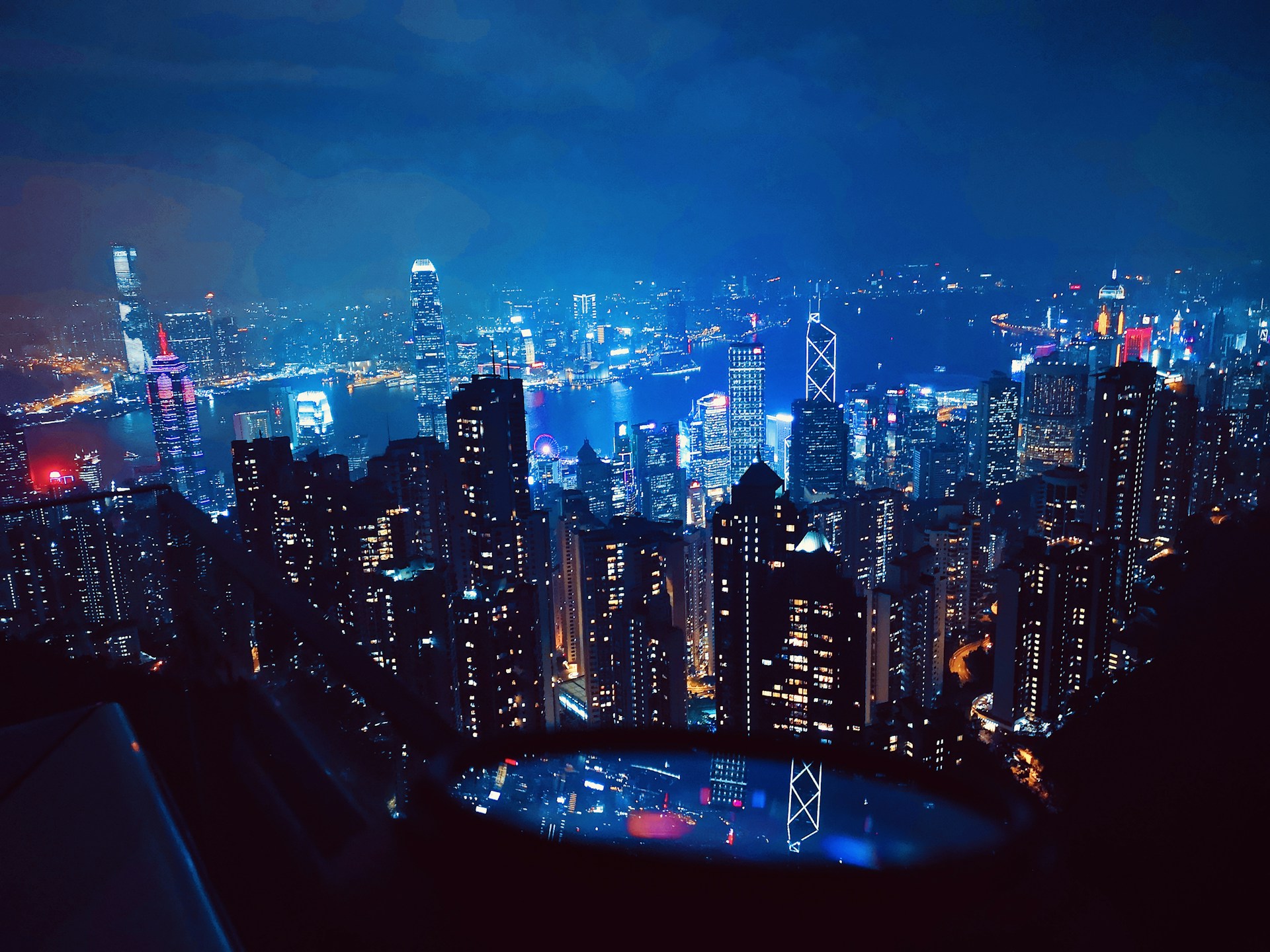 a view of a city at night from the top of a building