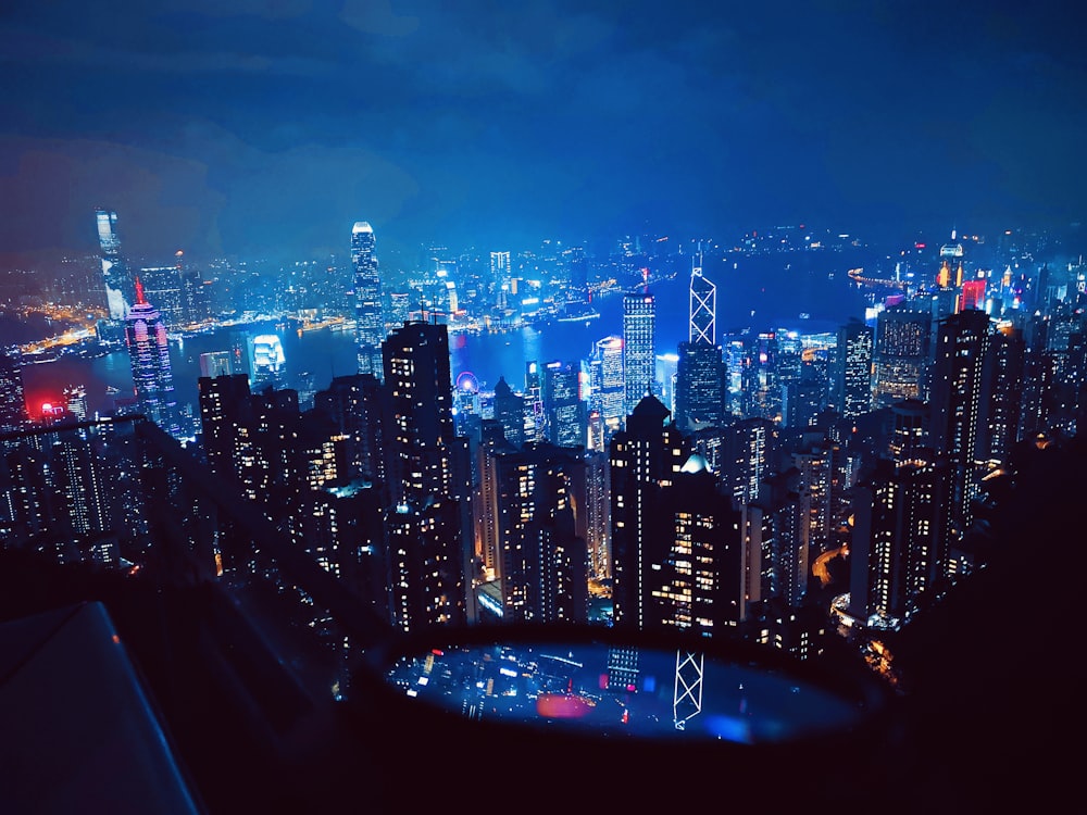 a view of a city at night from the top of a building