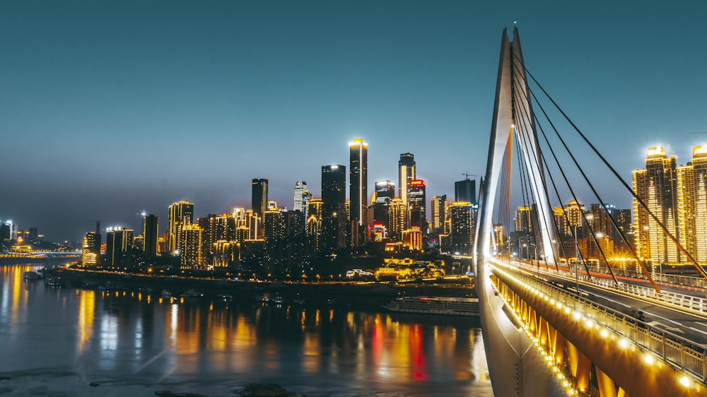 a view of a city at night from a bridge