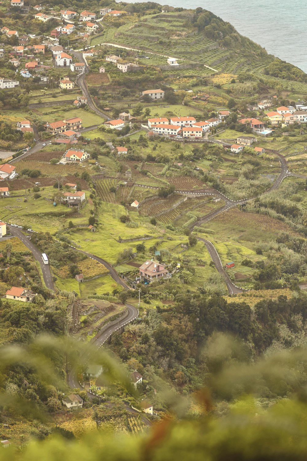 a scenic view of a small town on a hill