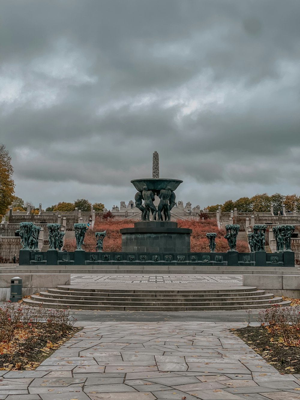 a large fountain in the middle of a park