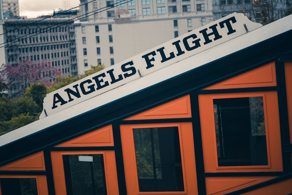 an orange building with a sign that says angels flight