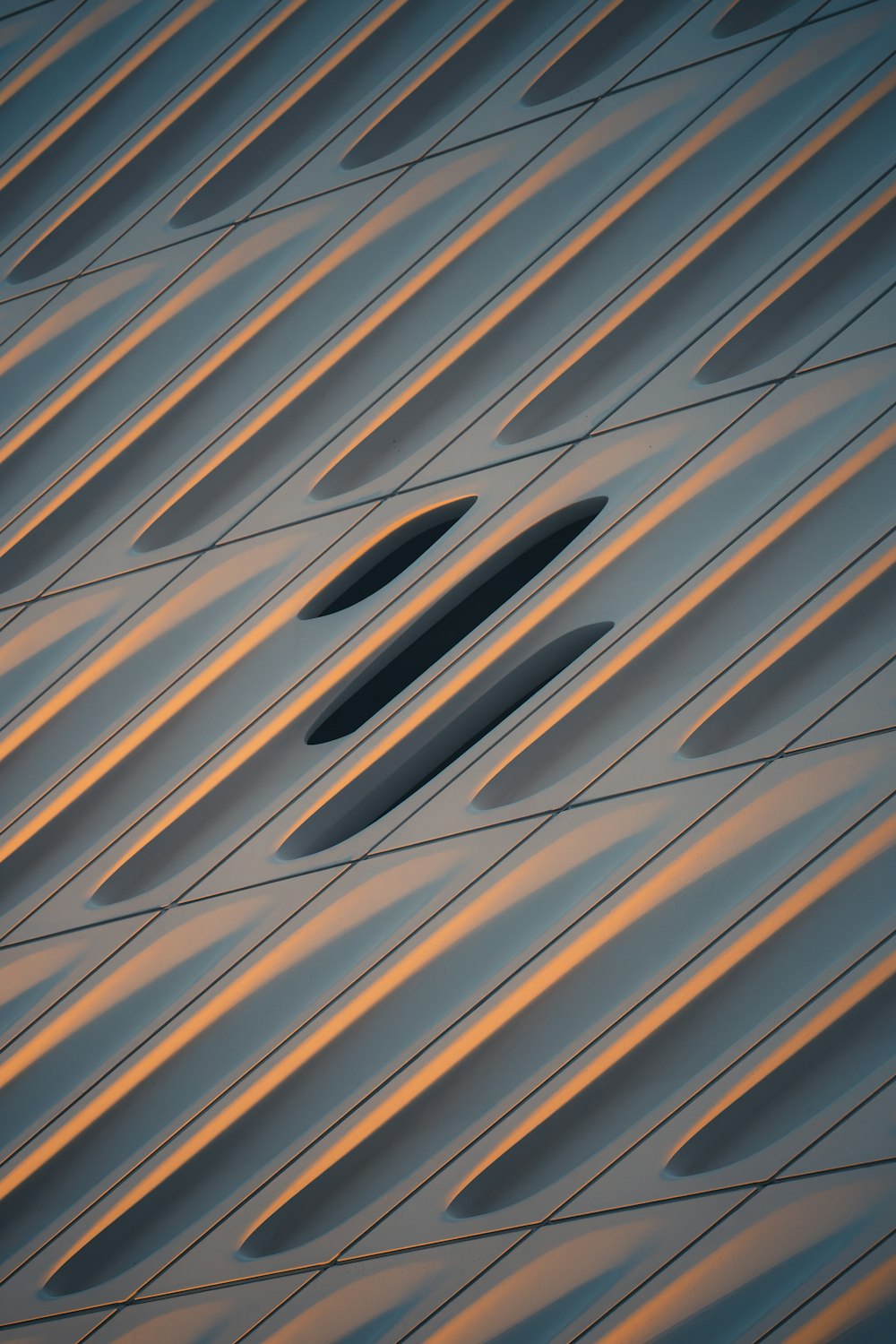 a close up of a metal structure with a sky in the background