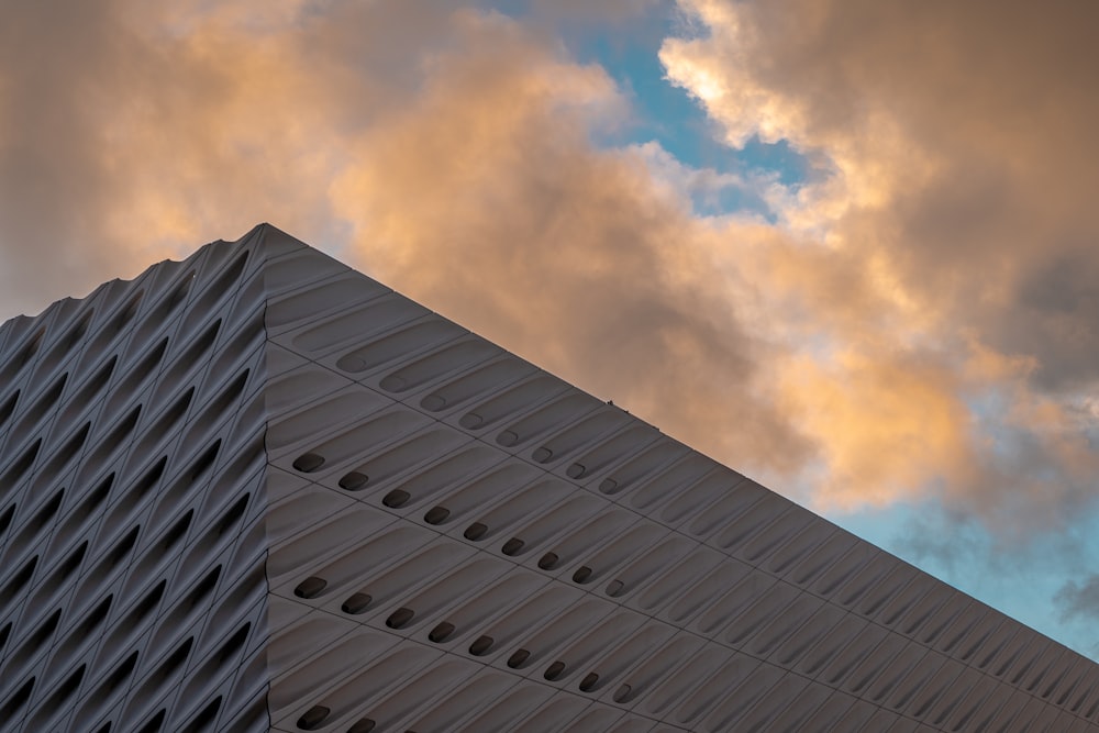 a tall building with a sky in the background