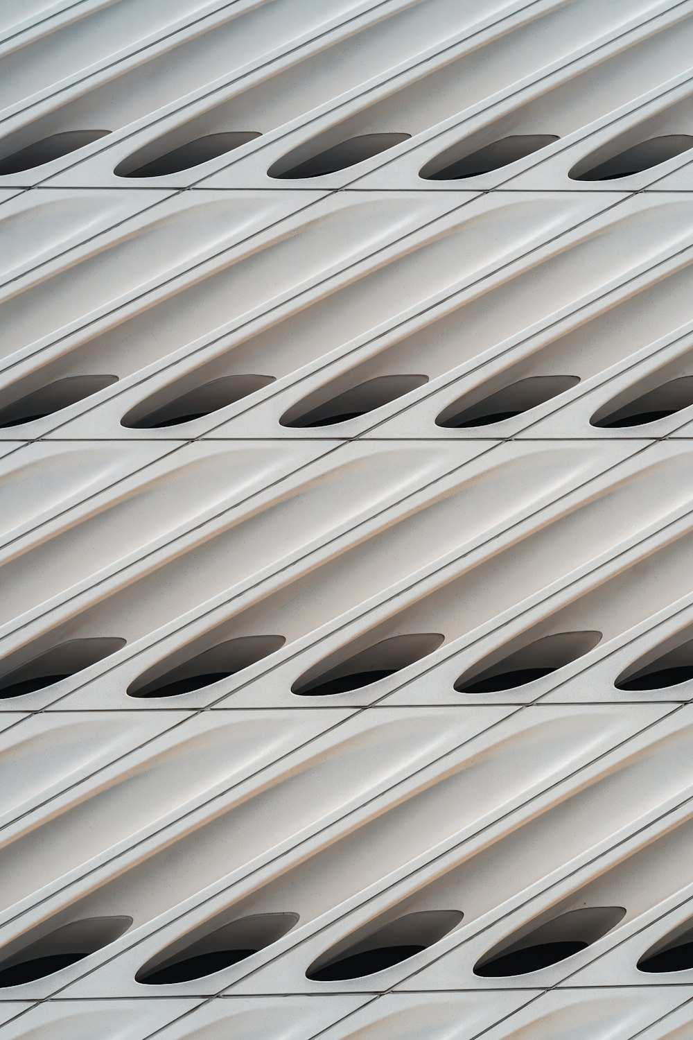 a close up of a metal structure with holes in it