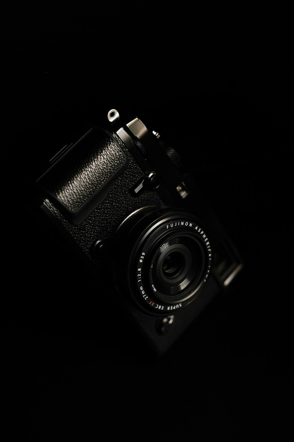 a camera in the dark on a black background