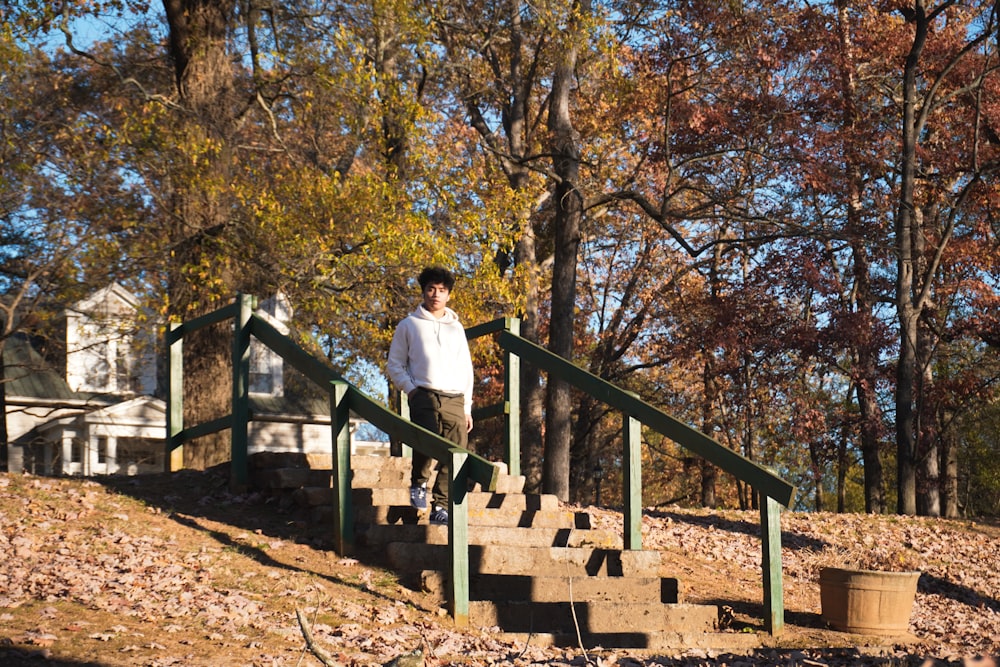 a man is standing on a set of stairs