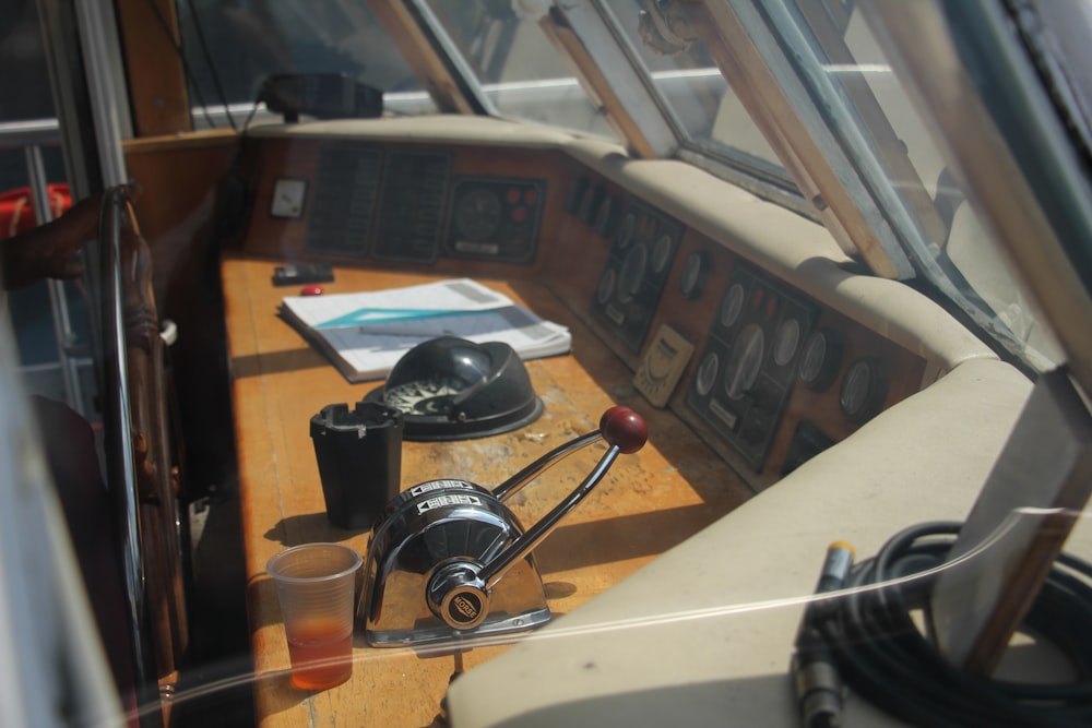 a boat with a camera and other items on the deck