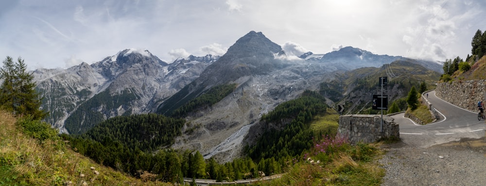 a scenic view of a mountain with a winding road