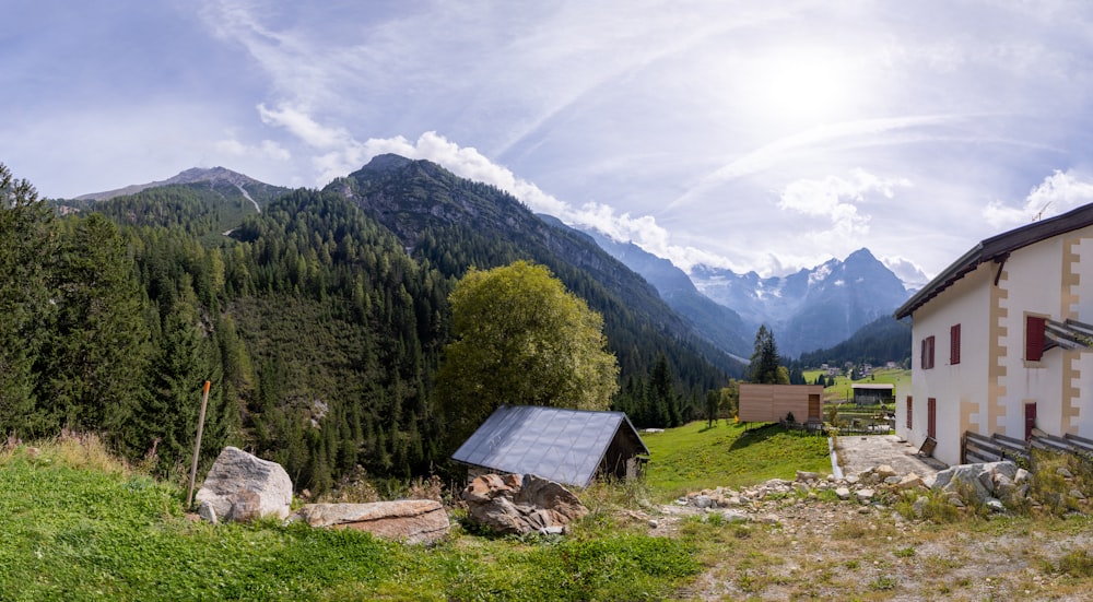 a house in the middle of a mountain range