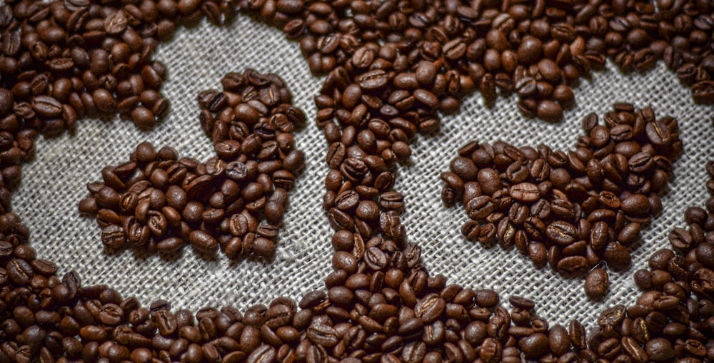 a close up of coffee beans on a cloth