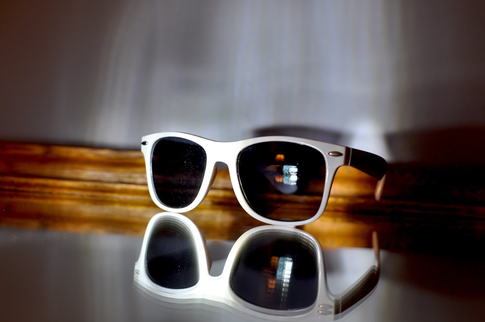 a pair of sunglasses sitting on top of a table