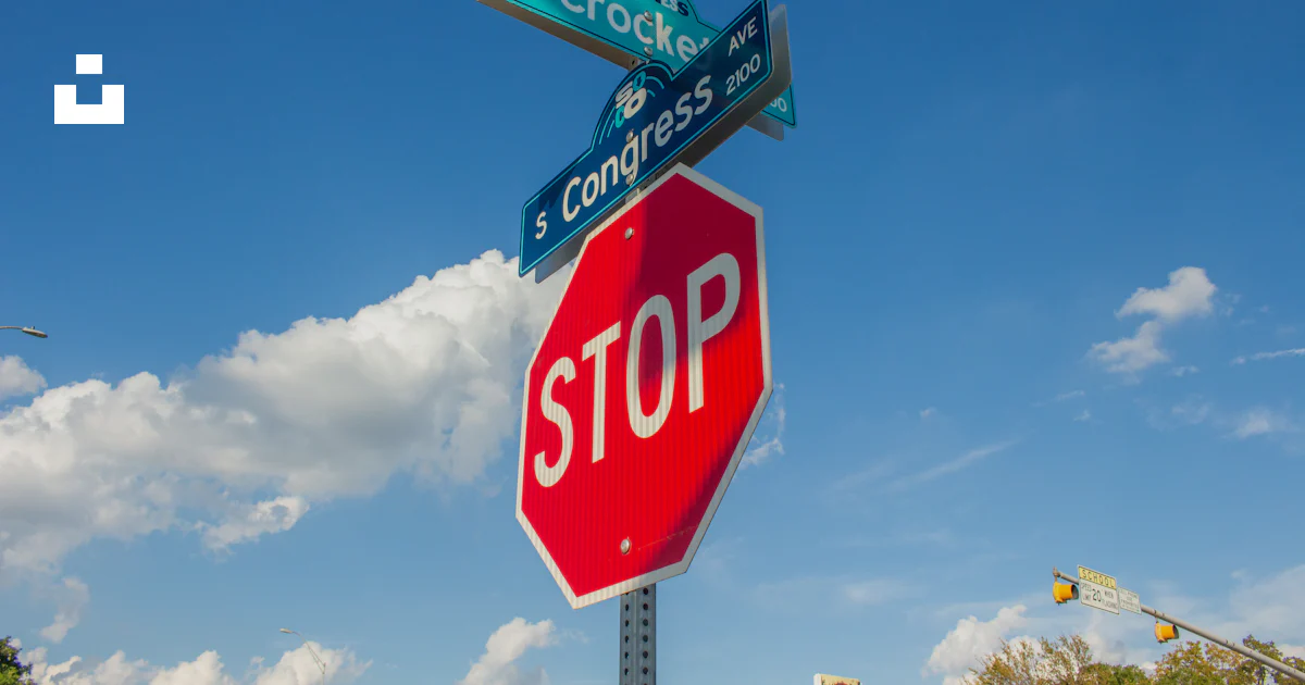 Stop Sign Under Sign A stop sign with street signs on top of it photo – Free Austin Image on ...