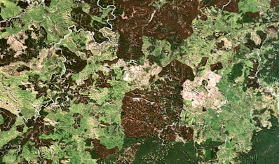 A satellite view showing a property with detected encroachment areas highlighted.
