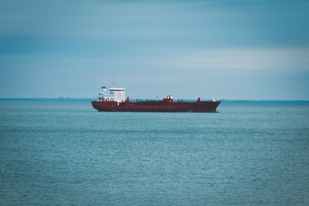 a large boat floating on top of a large body of water