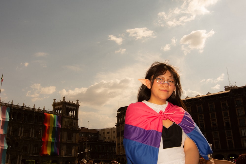 a woman wearing a colorful scarf and glasses