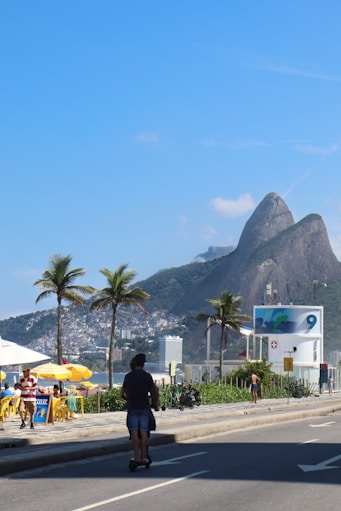 a person riding a skateboard down a street