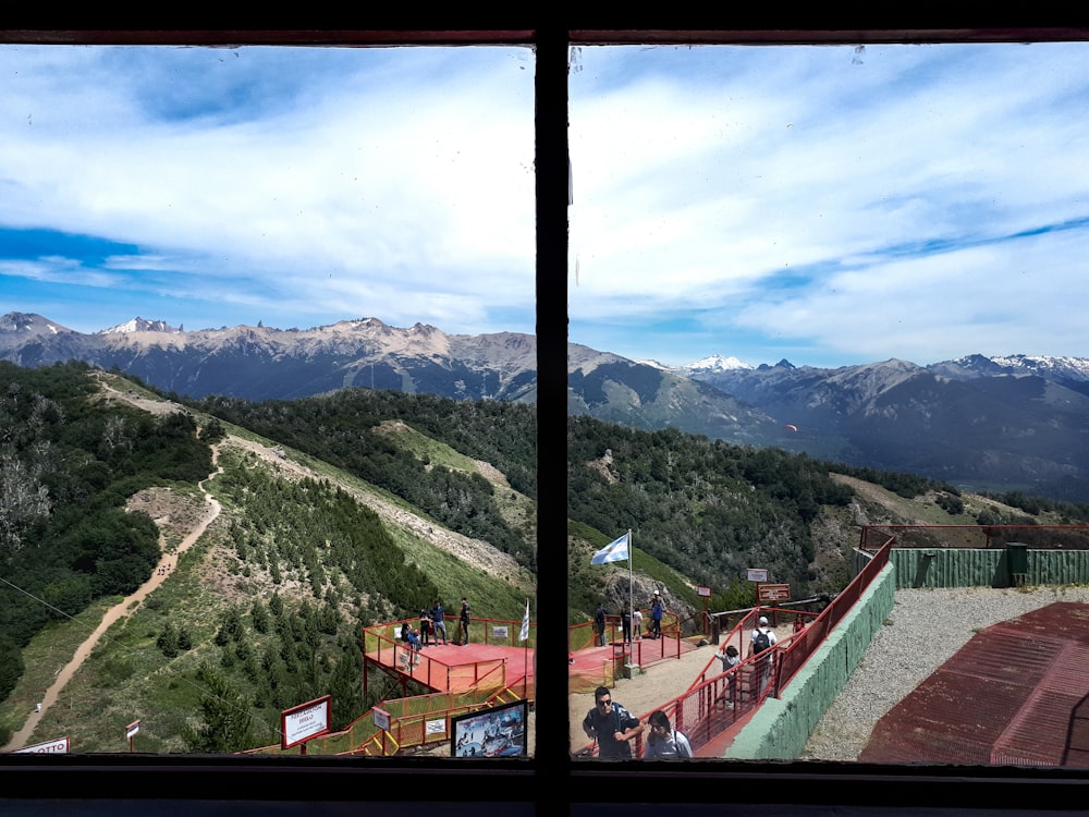 a view of a mountain range from a window