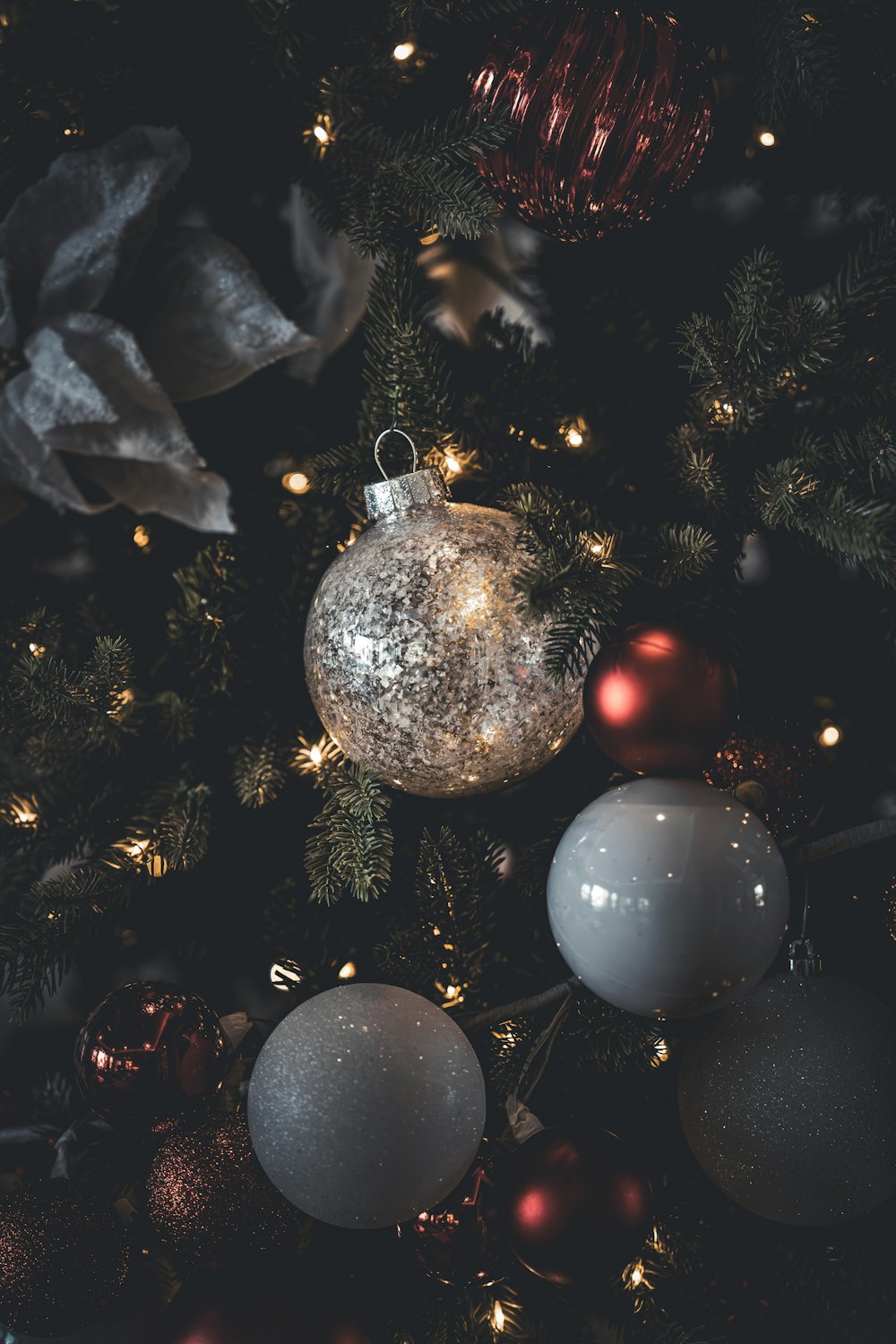 a close up of a christmas tree with ornaments