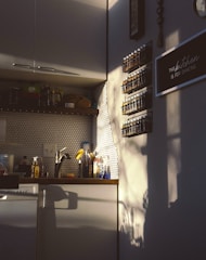 A warm, sunlit kitchen corner with jars of homemade preserves and fresh herbs hanging nearby.
