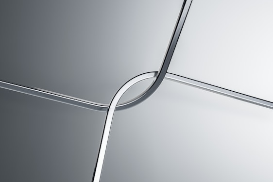 Elegant clean steel rods forming a pattern representing strength and precision, set against a soft industrial background.