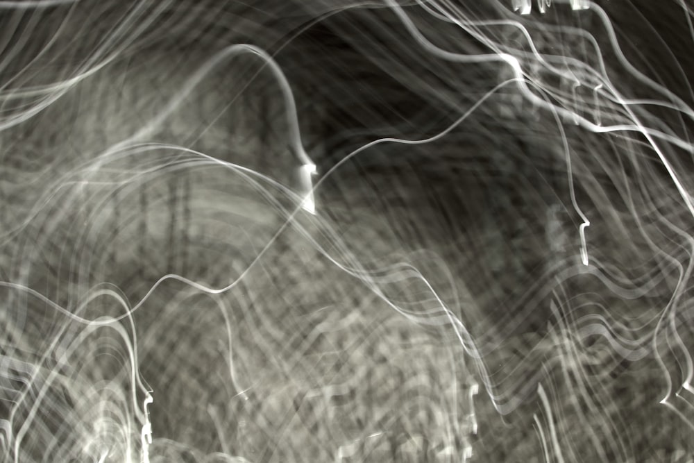 a black and white photo of light streaks