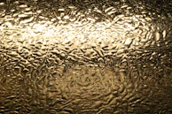 A selection of decorative paint finishes showcasing textures and metallic gold highlights.