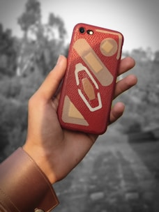 Close-up of a trendy patterned phone case with a blurred background.