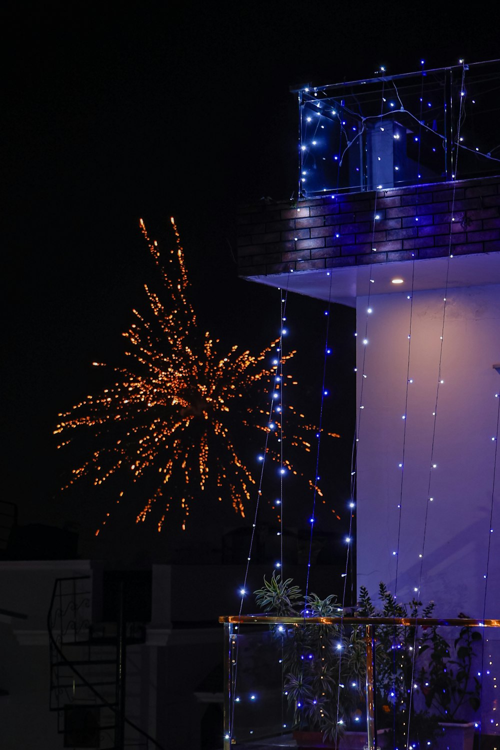 a large fireworks is lit up in the night sky