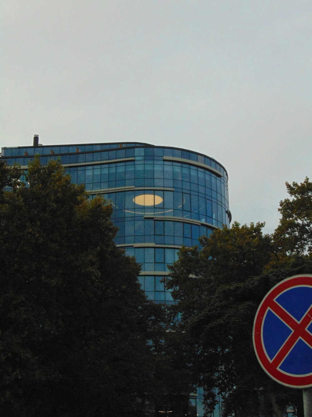 a blue building with a red and blue sign in front of it