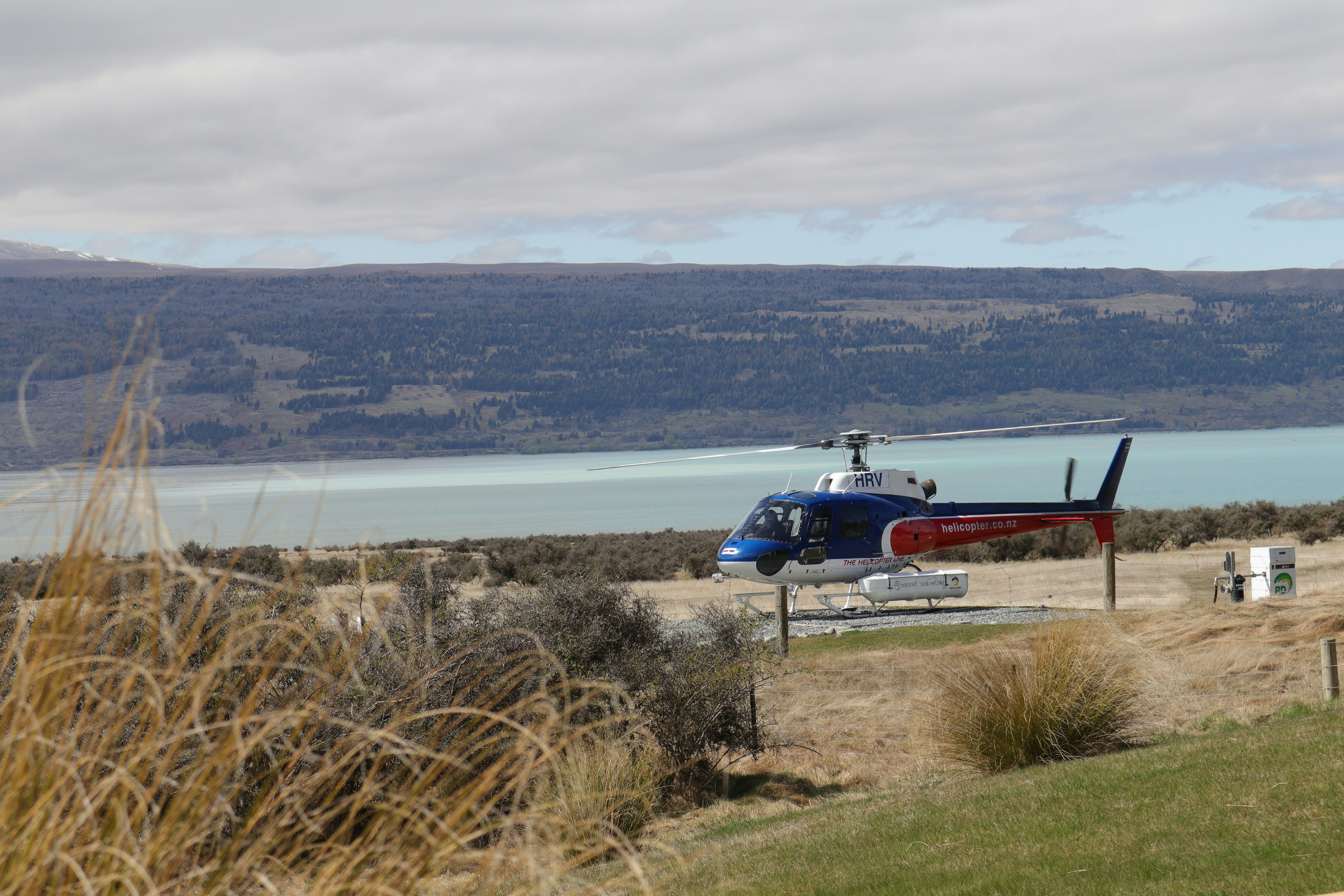 a helicopter is parked on the side of the road