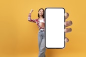 A satisfied customer holding their new mobile phone.