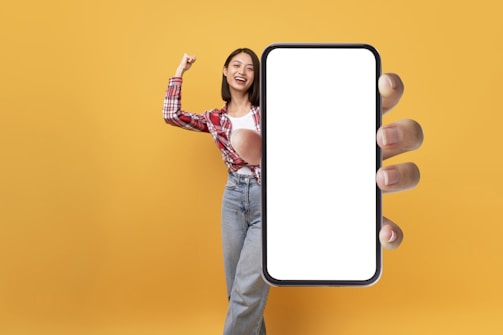 A friendly person holding a smartphone, ready to connect.