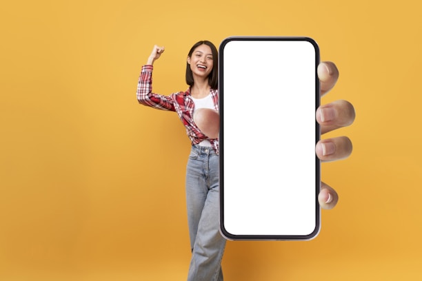A cheerful person holding a smartphone displaying the btc meme on the Solana blockchain.