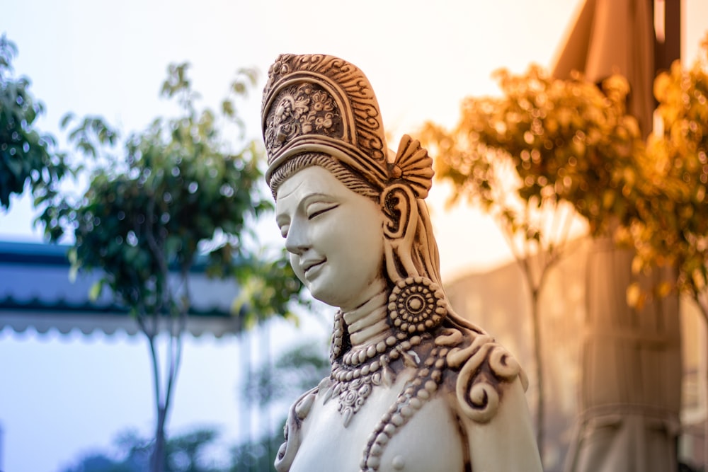 a statue of a woman wearing a headdress