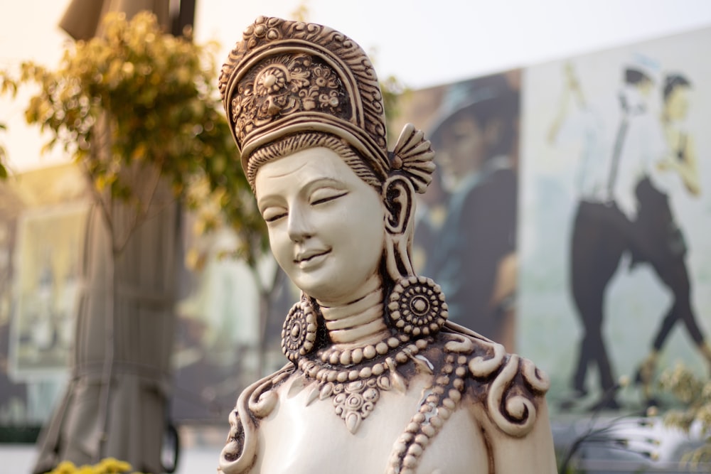 a statue of a woman wearing a headdress