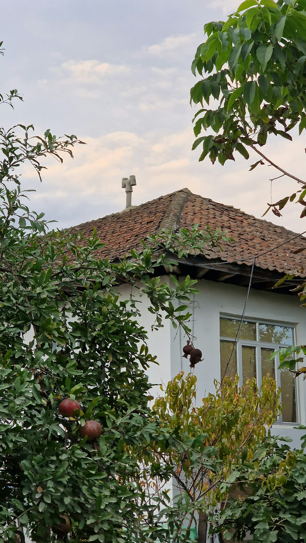 a white house with a cross on top of it