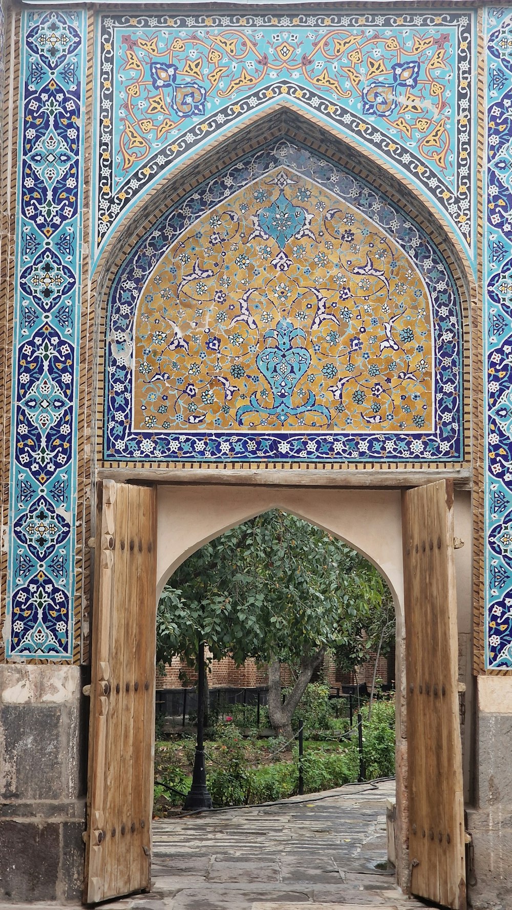 a large archway with a blue and yellow design on it