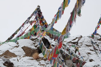 a mountain covered in lots of colorful flags