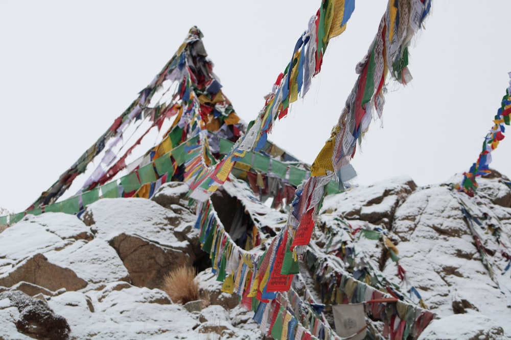 a mountain covered in lots of colorful flags