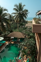 Inviting swimming pool area with lounge chairs and greenery.