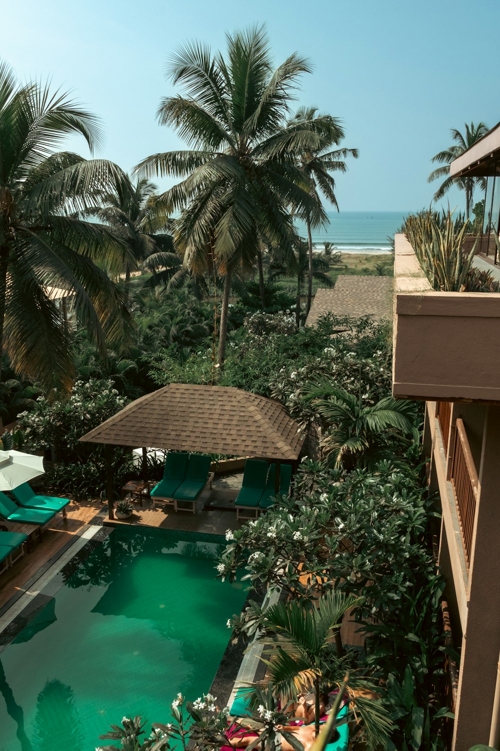 a view of a pool from a hotel room