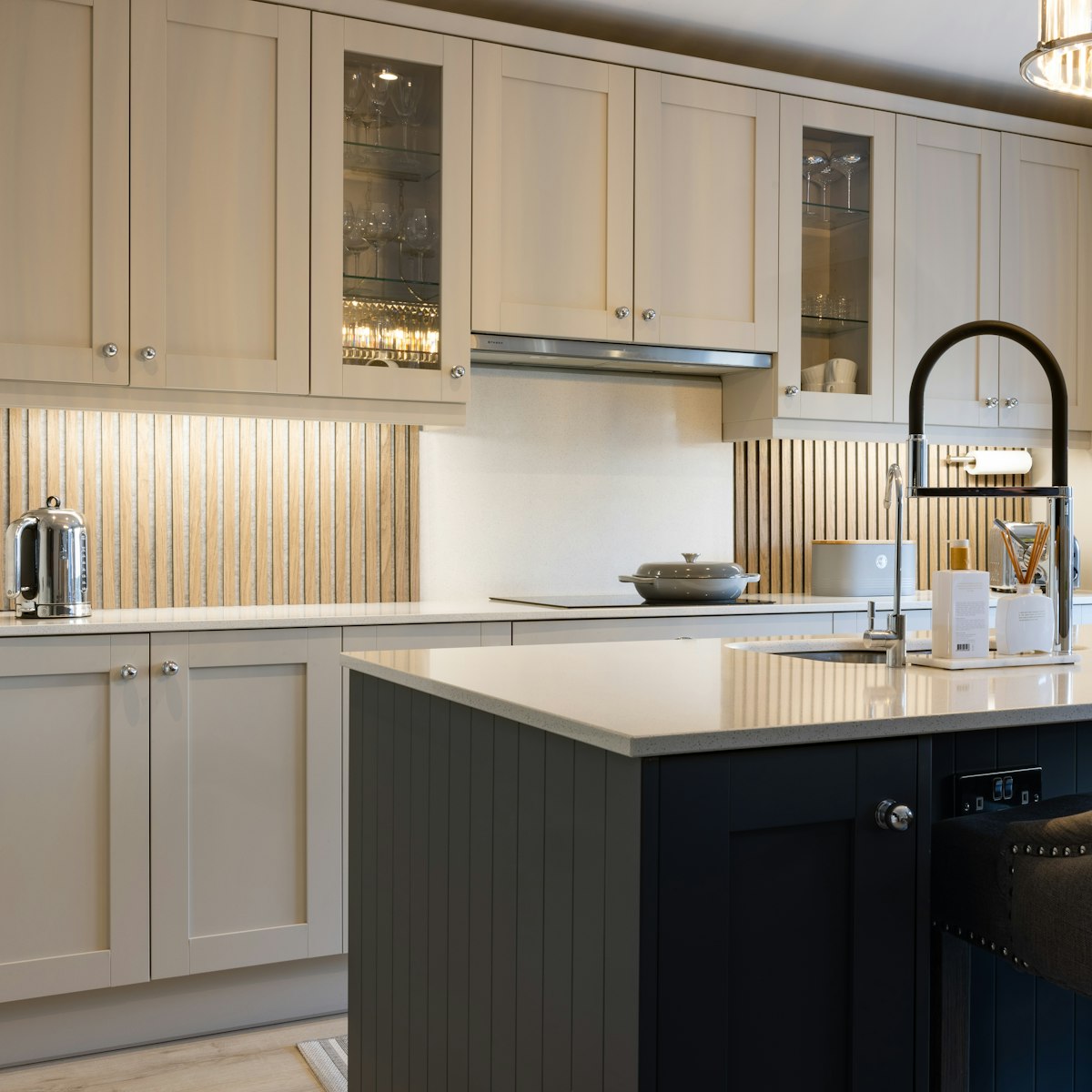 A kitchen with a black faucet