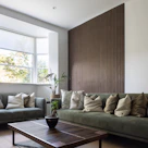 a living room filled with furniture and a large window