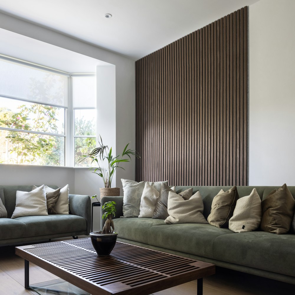 a living room filled with furniture and a large window