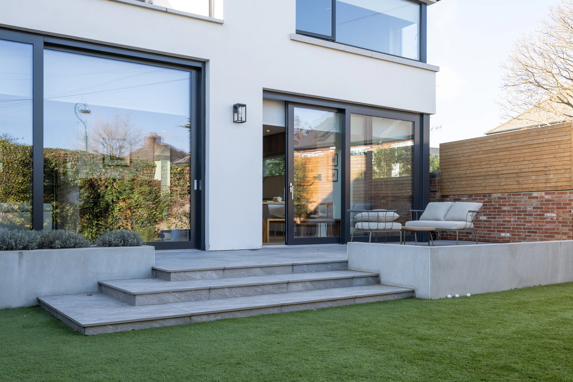 a house with a lawn and steps leading to it
